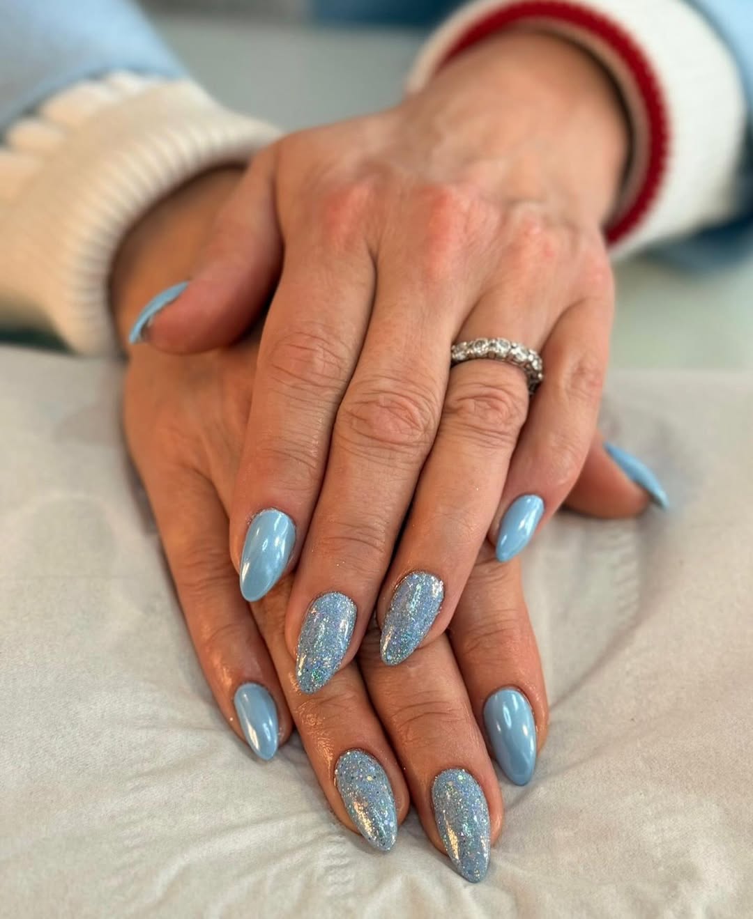 Blue Almond Nails with Holographic Glitter Accent