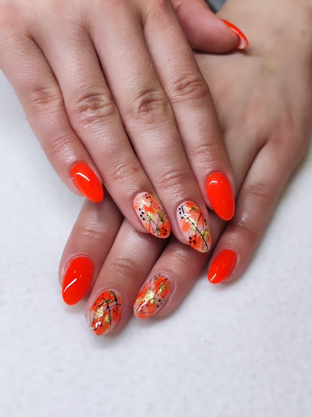 Bright Orange Almond Nails with Gold Foil Abstract Art