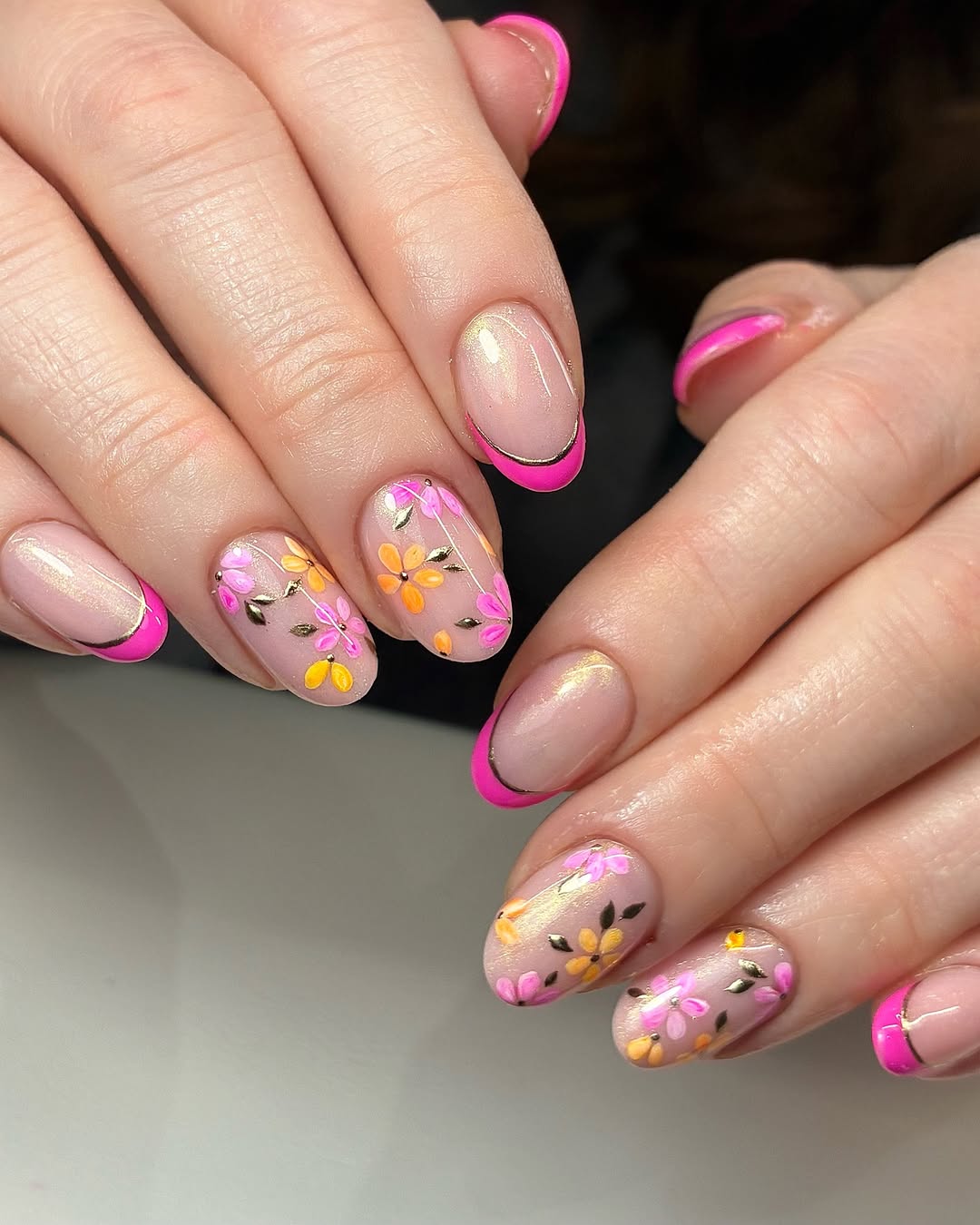 Bright Pink French Tips With Gold Accent And Floral Decals