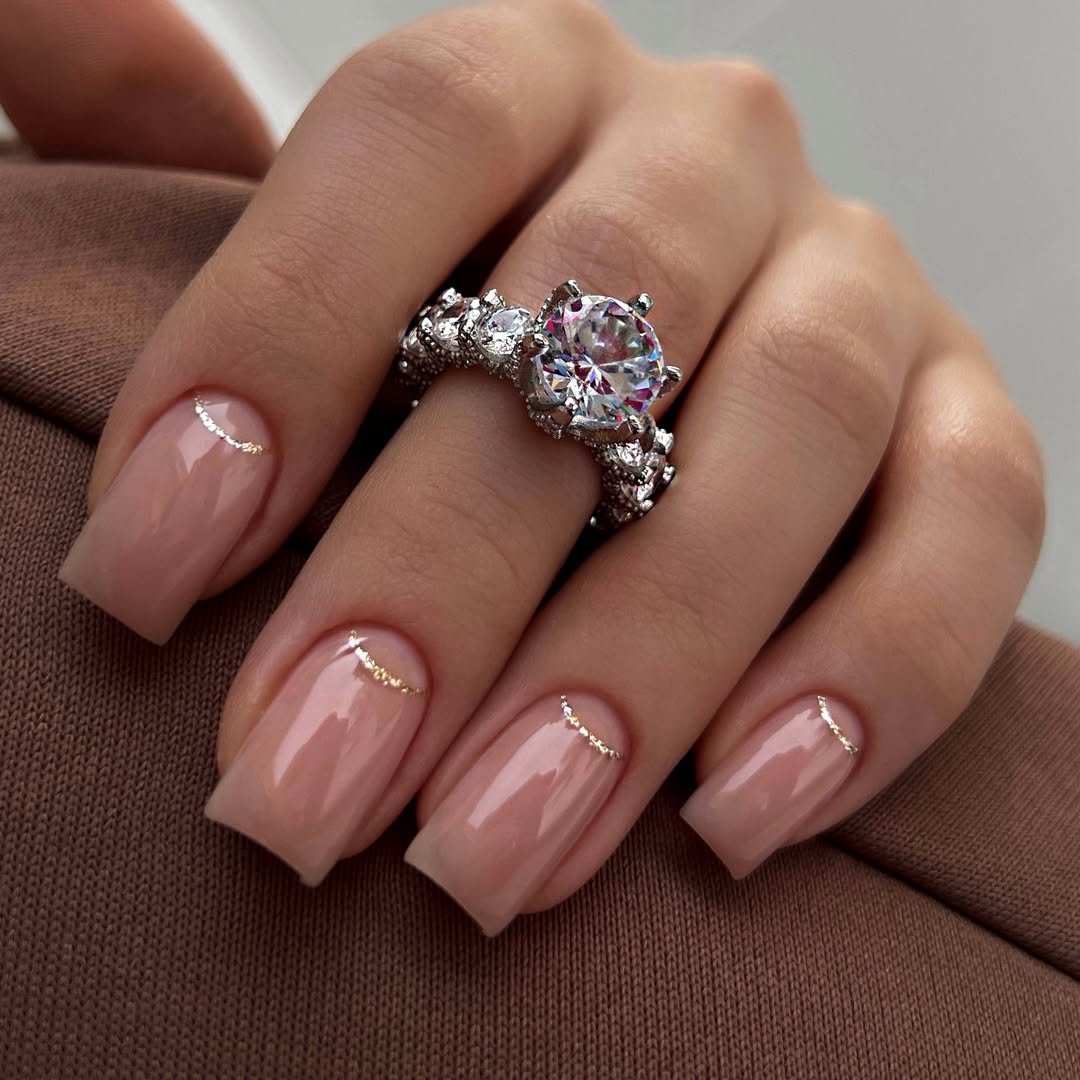 Delicate Gold Crescent Accents on Nude Coffin Nails