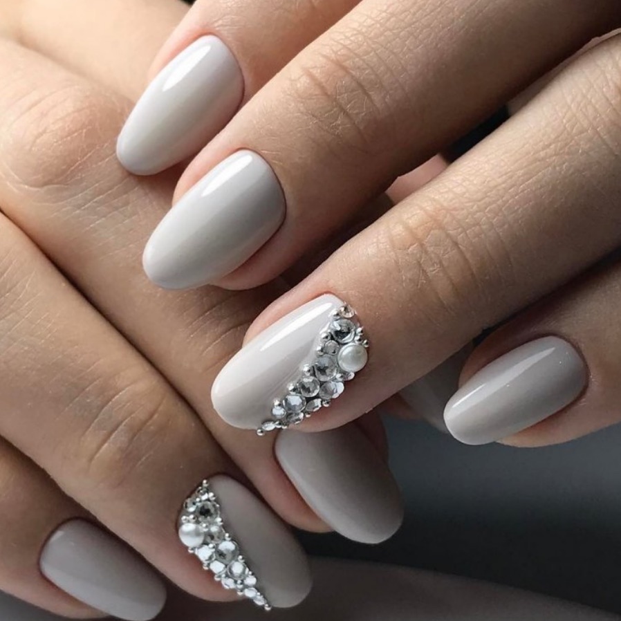 Elegant Greige Oval Nails With Pearl Rhinestone Accents