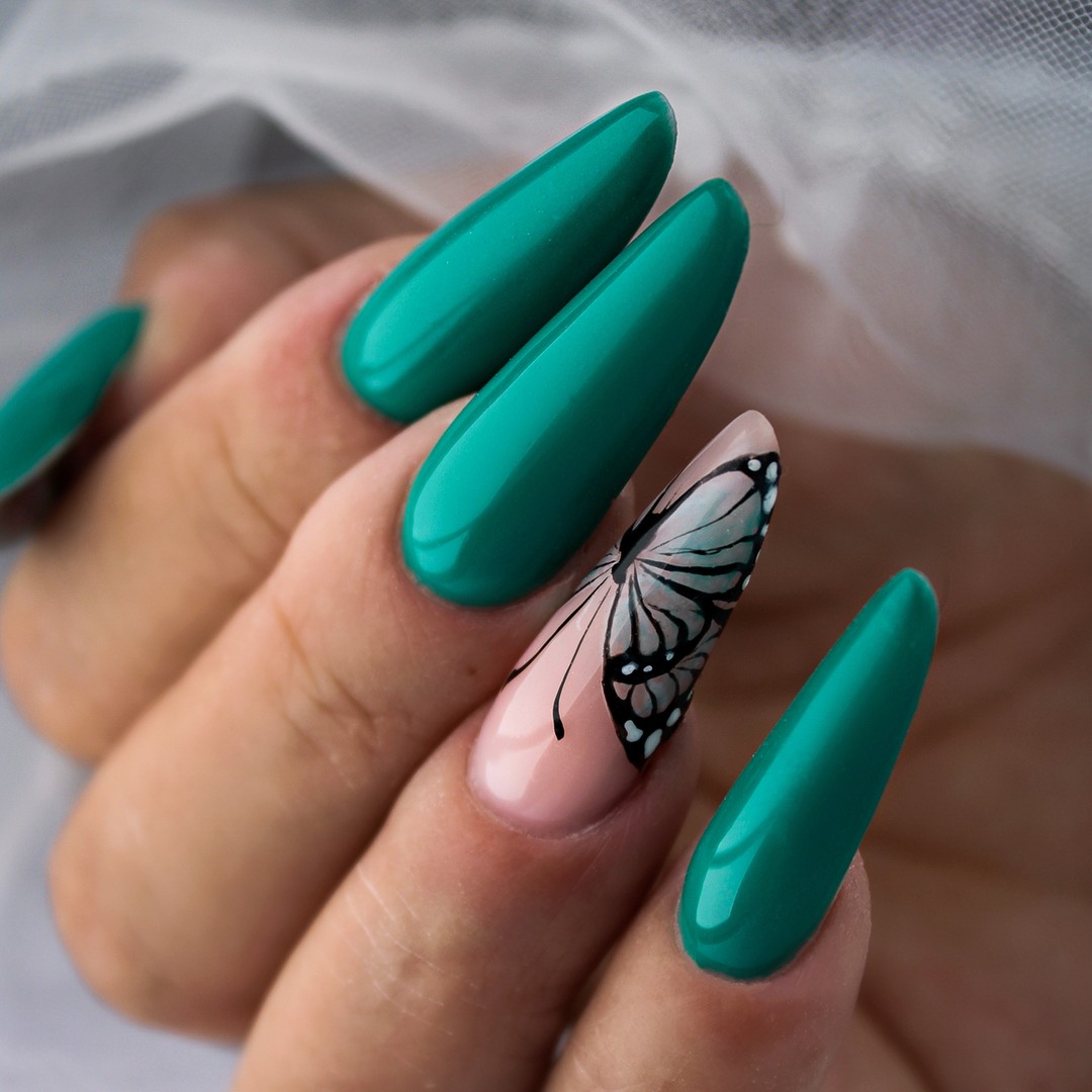 Emerald Green Almond Nails with Butterfly Accent