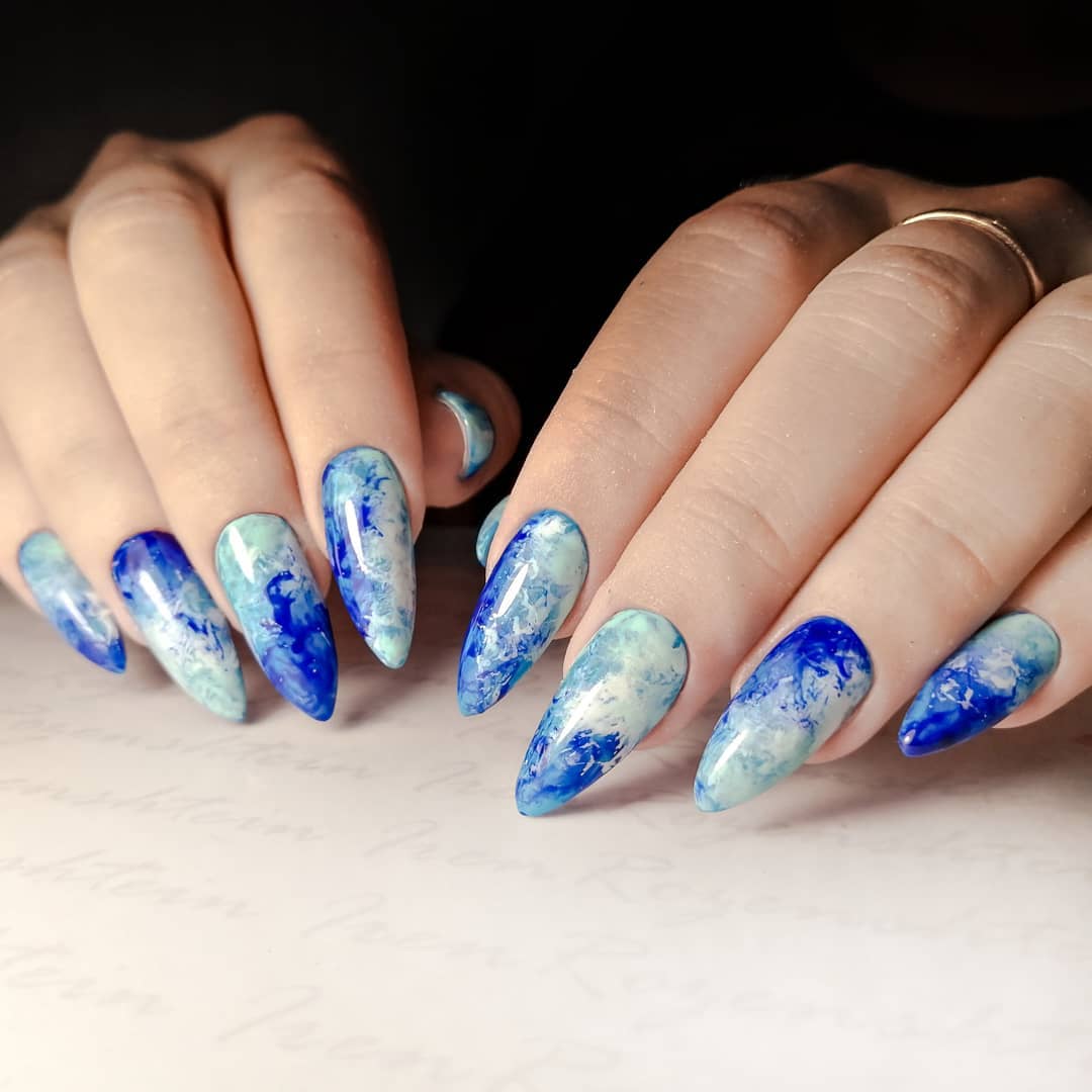 Glossy Blue and White Marble Stiletto Nails