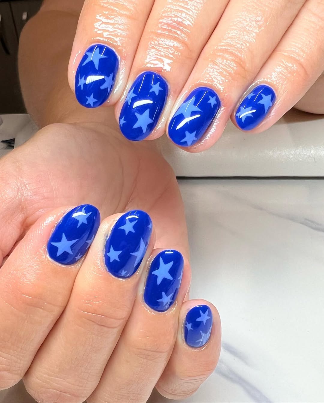 Glossy Royal Blue Star Pattern Oval Nails