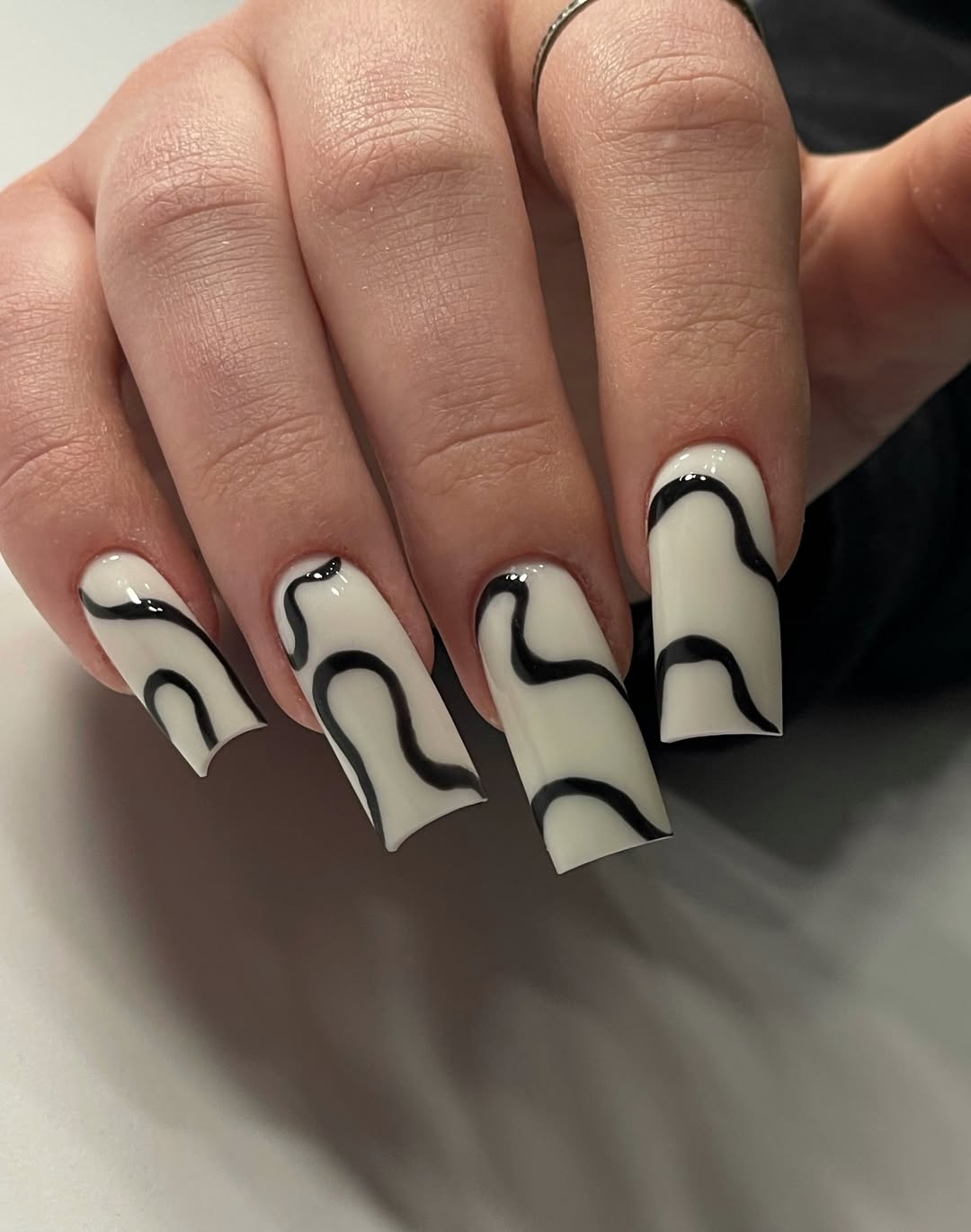 Glossy White and Black Wavy Line Accent Nails