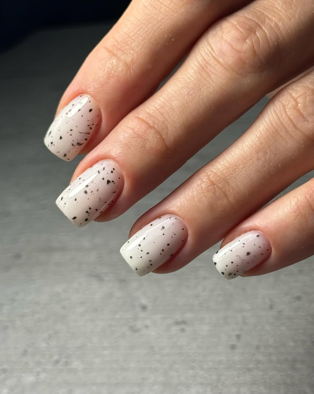 Glossy White Speckled Squoval Nails