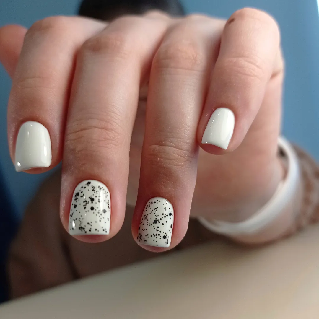 Glossy White Speckled Squoval Short Gel Nails