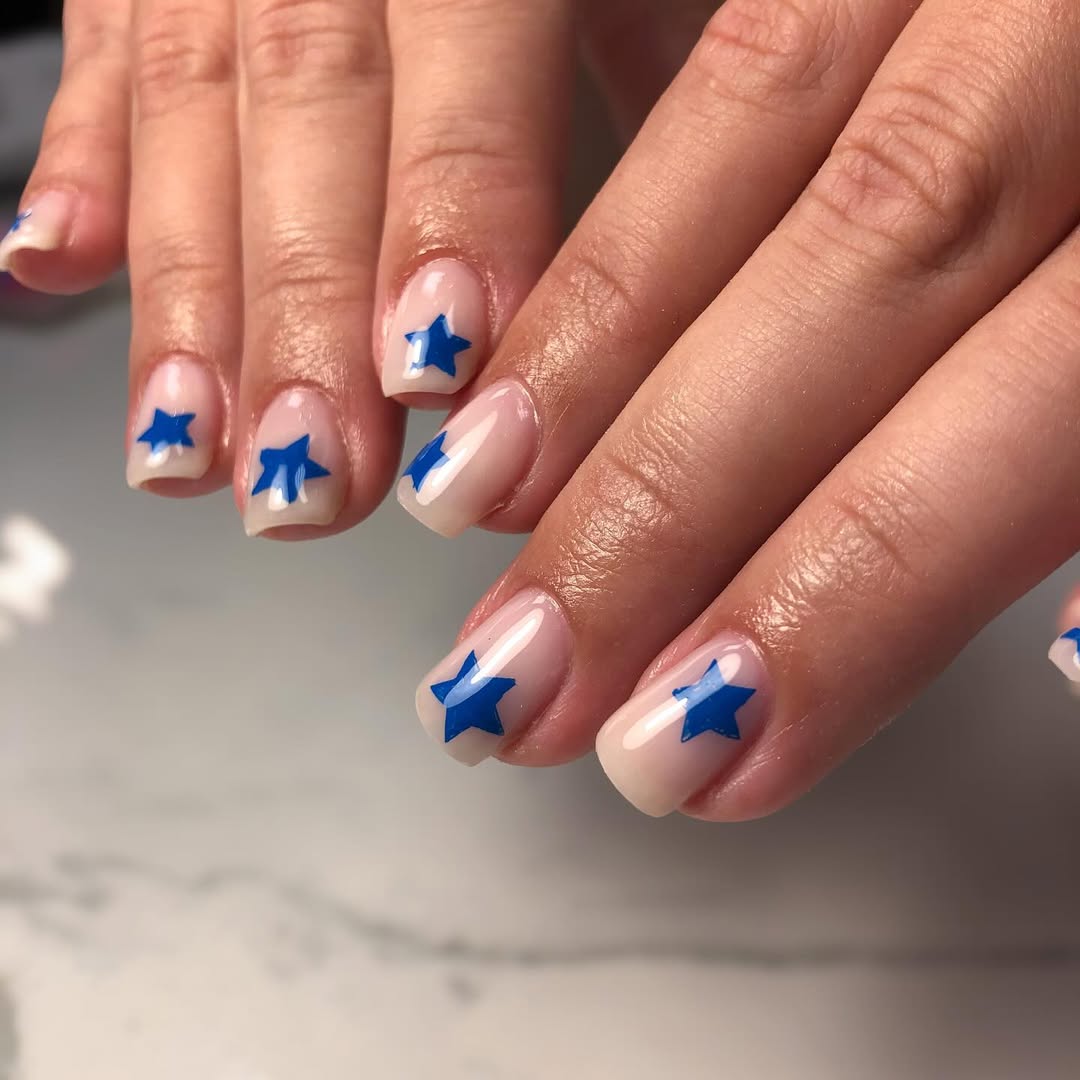 Milky Pink Glossy Nails With Blue Star Decals