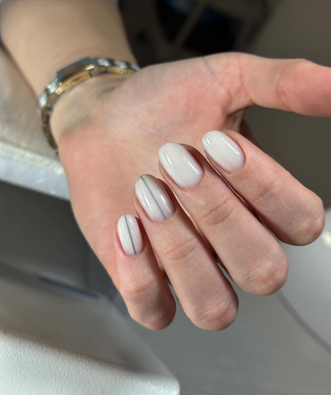 Milky White Glossy Oval Nails With Silver Stripe