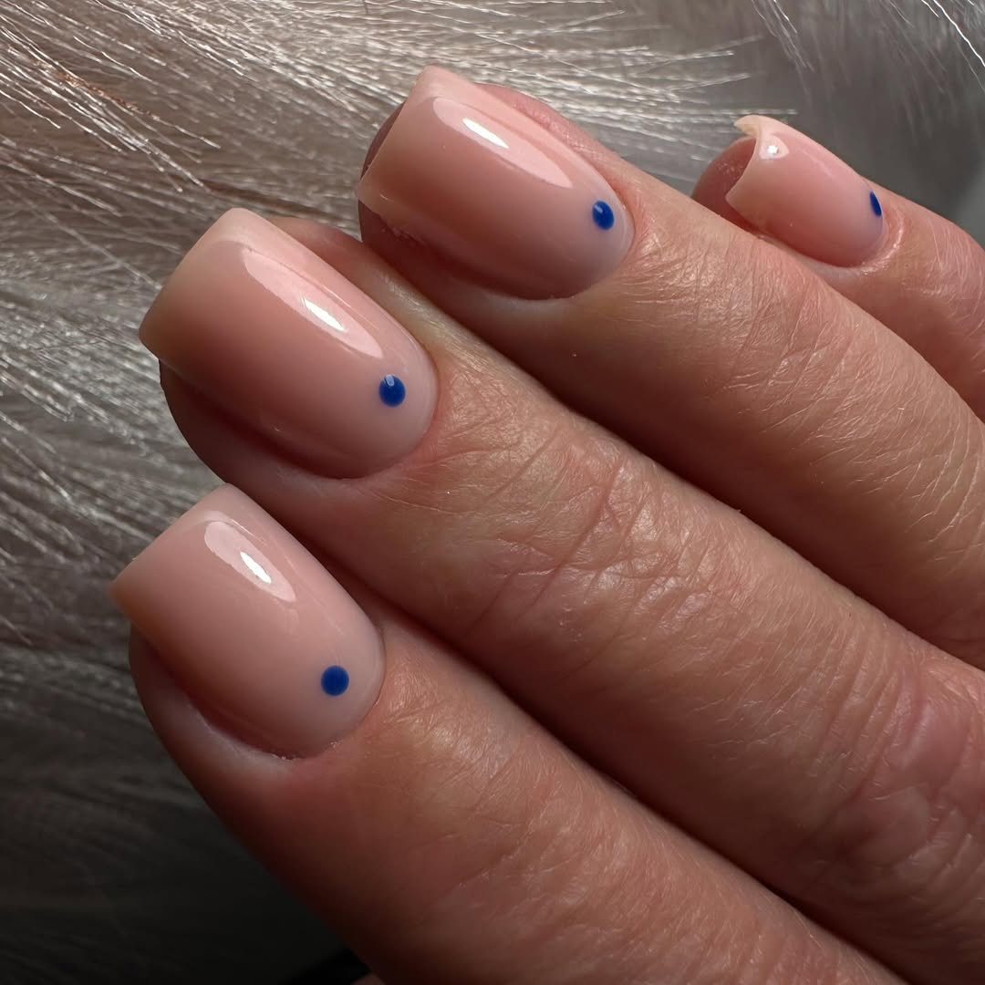 Minimal Nude with Pop of Blue Dot Nails
