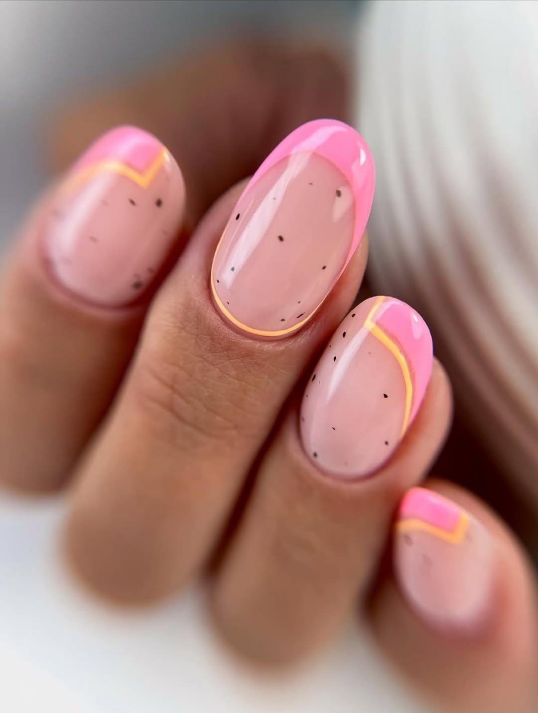 Neon Pink French Tips with Yellow Accents and Black Specks