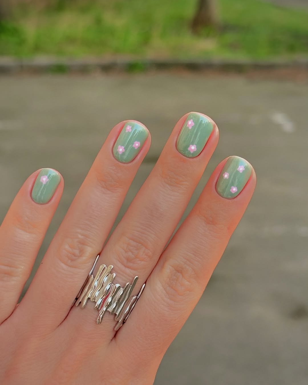 Pastel Green Nail Art With Dainty Pink Flowers