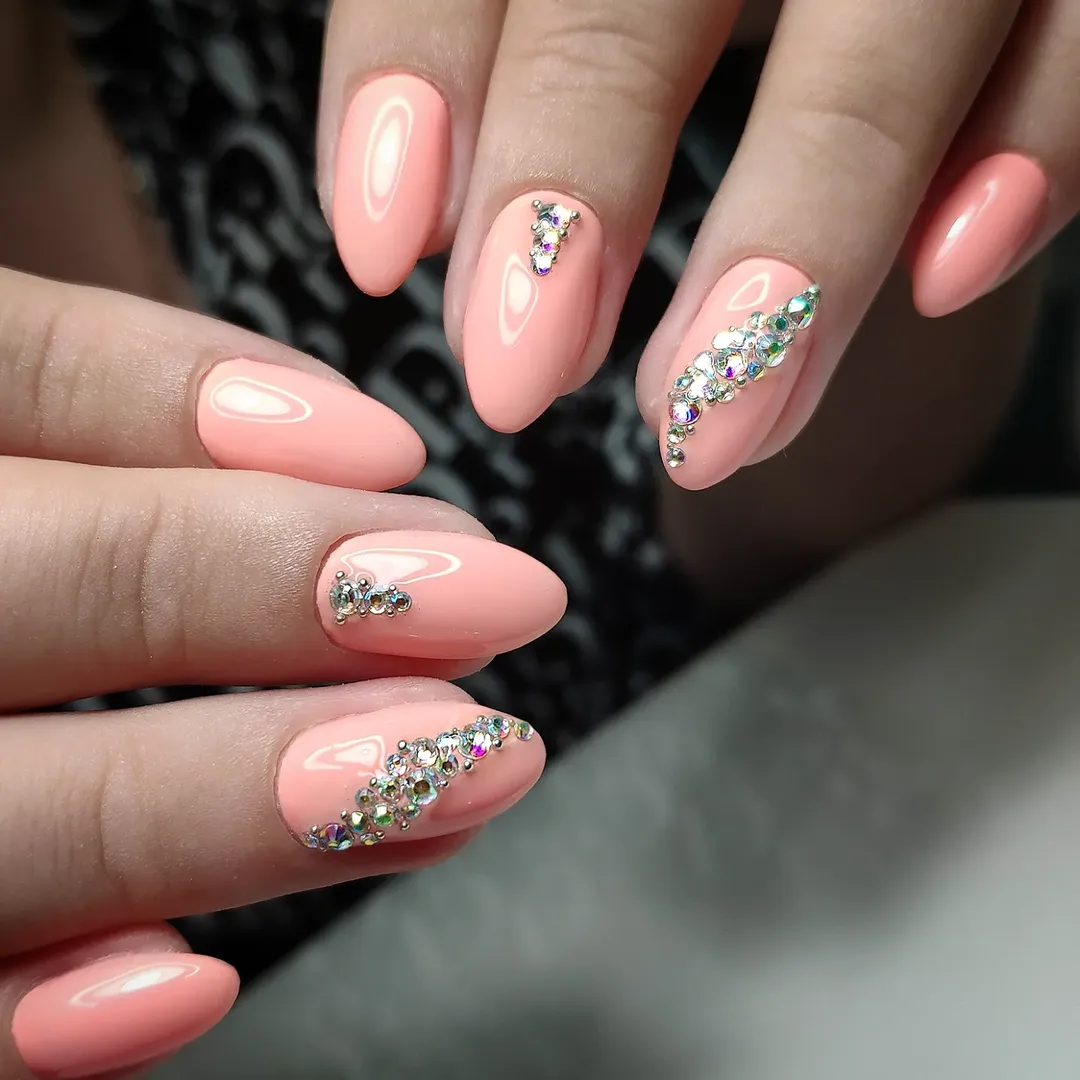 Peachy Pink Almond Nails with Rhinestone Accents