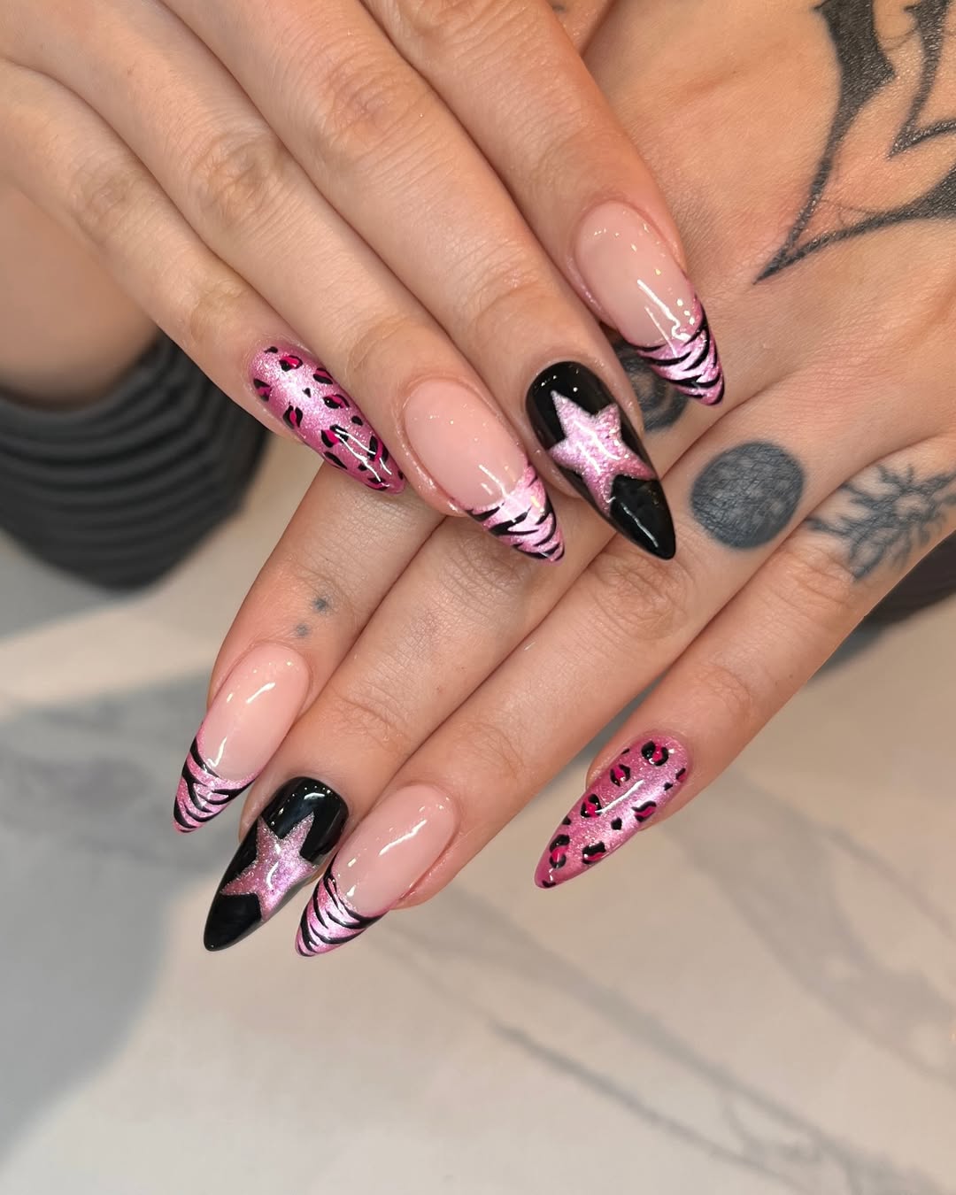 Pink Cheetah Print And Black Star Stiletto Nails