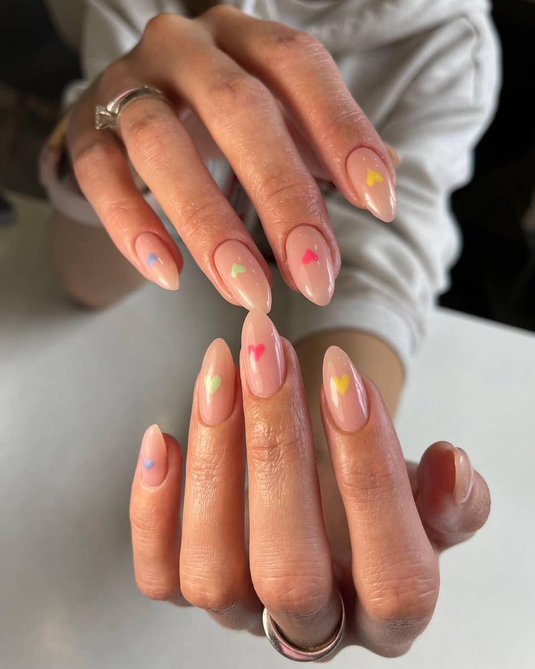 Playful Pastel Heart Almond Nude Nails
