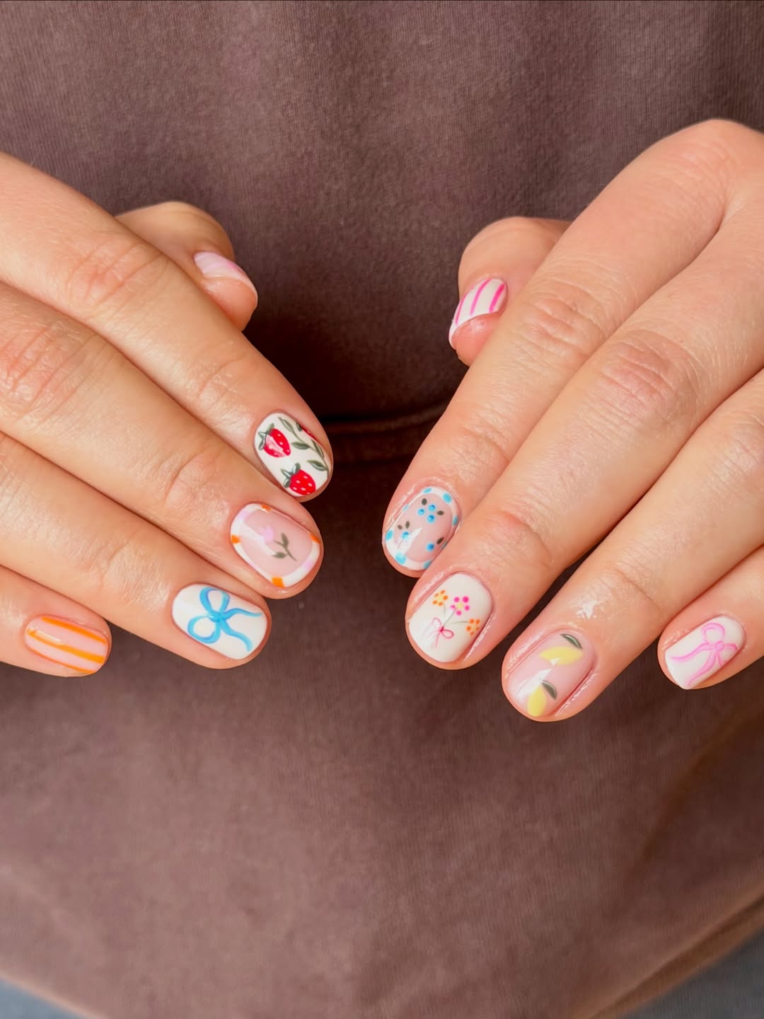Playful Pastel Mismatched Nail Art for Short Round Nails