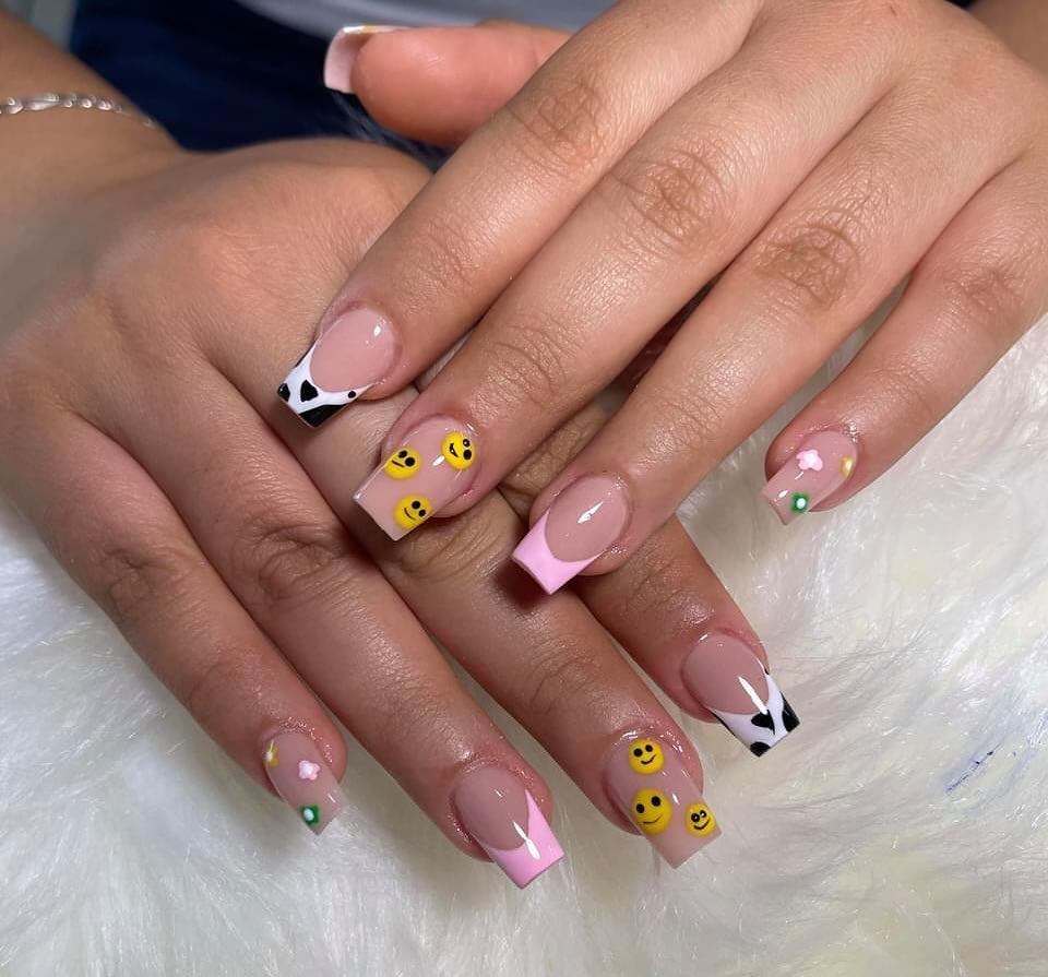 Playful Smiley Faced Cow Print French Tips