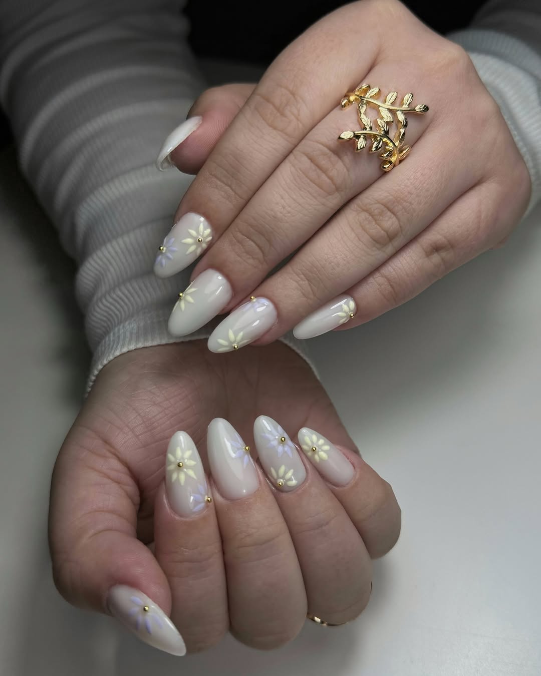 Soft Pastel Floral Almond Nails with Gold Studs