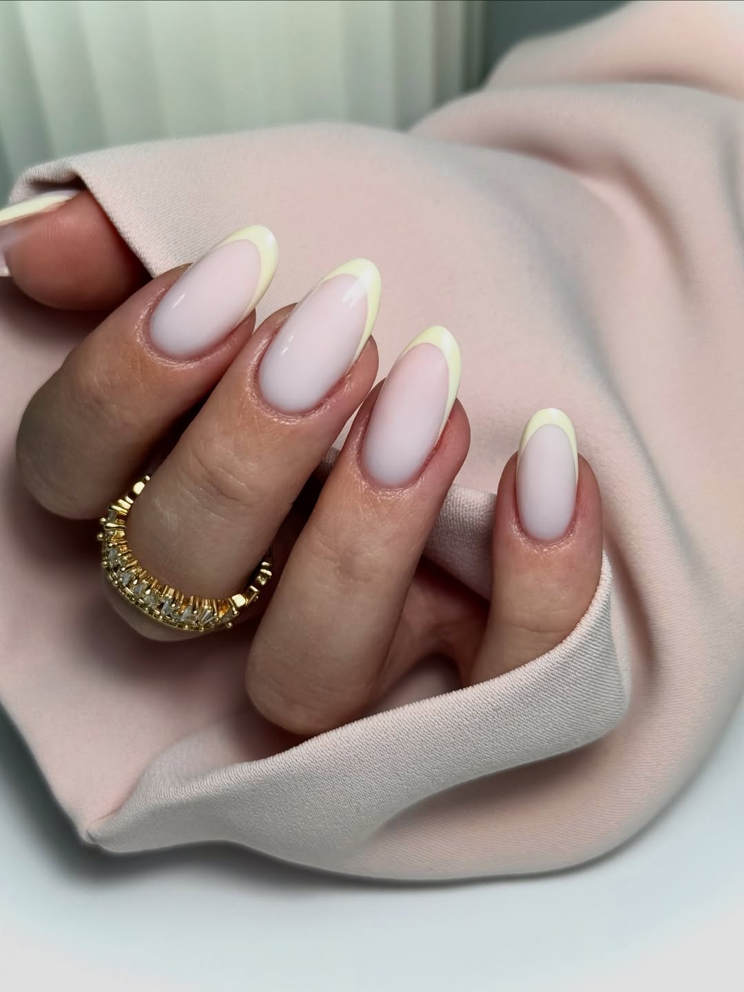 Soft Pastel Yellow French Tip Oval Nails