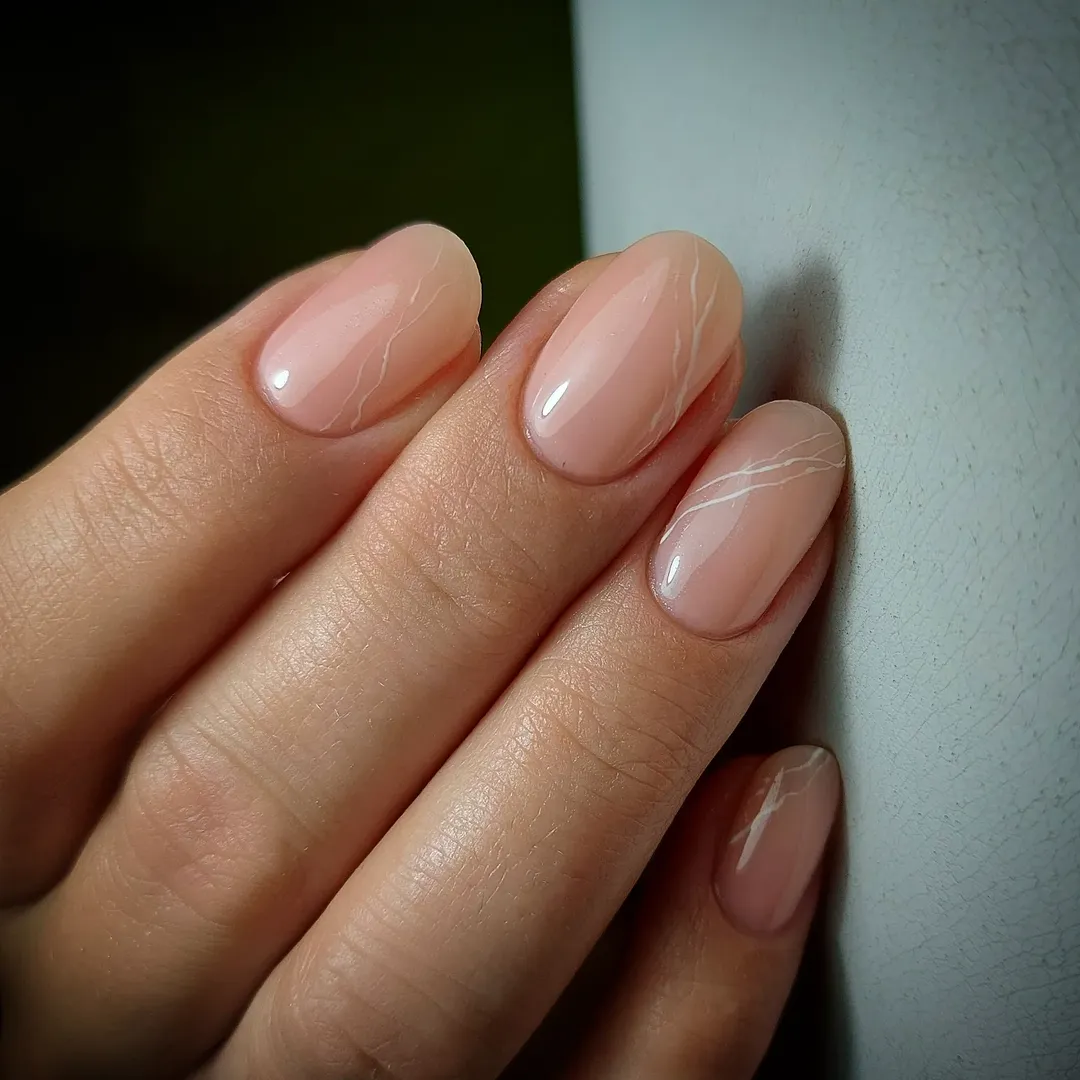 Soft Peach Gel Nails With Delicate White Marble