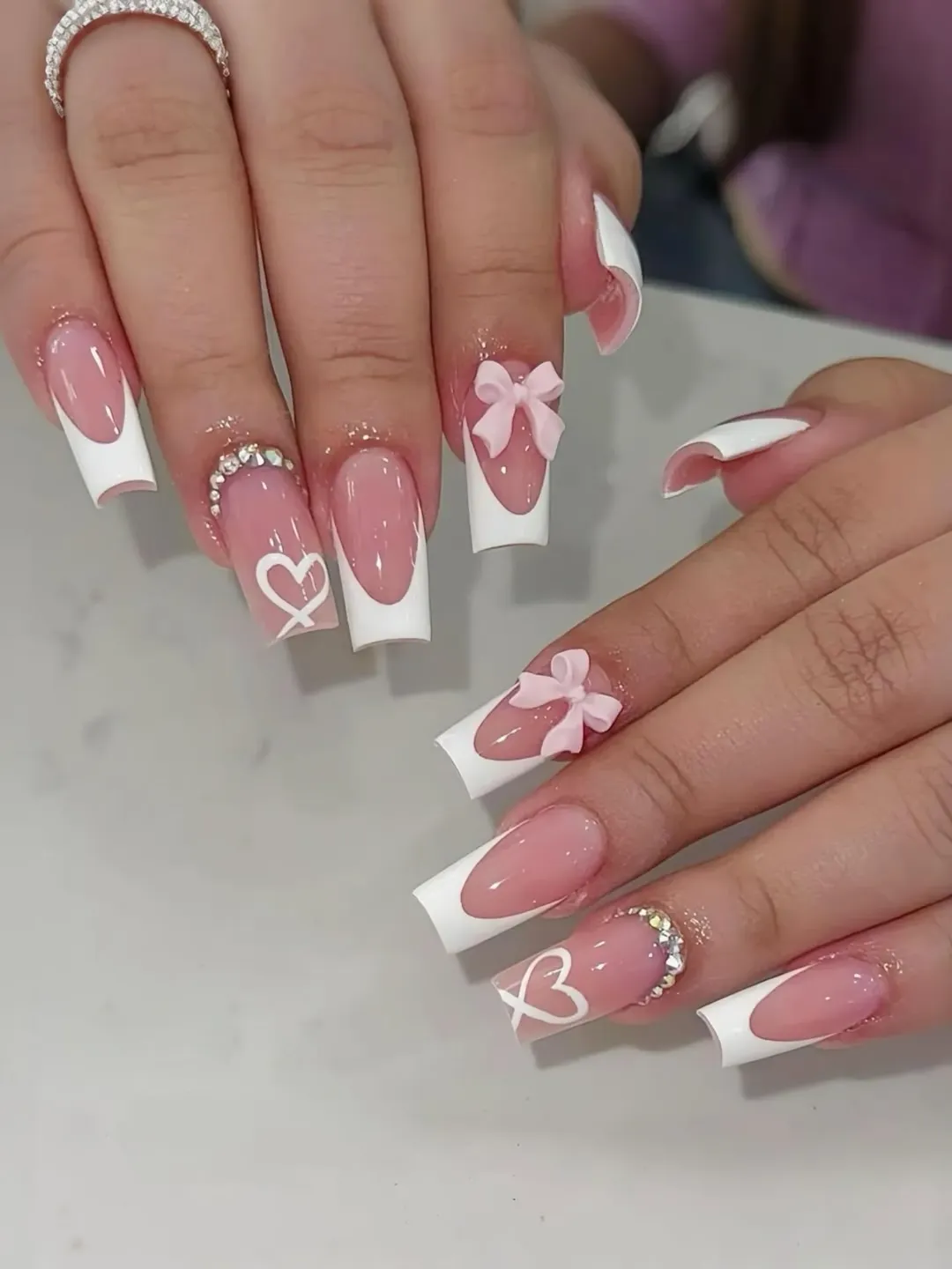 Soft Pink French Tips with 3D Bows and Rhinestones
