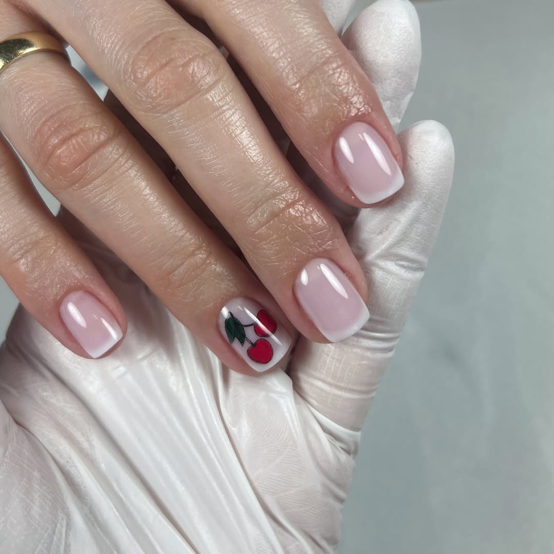 Soft Pink French Tips with Cherry Accent Nail