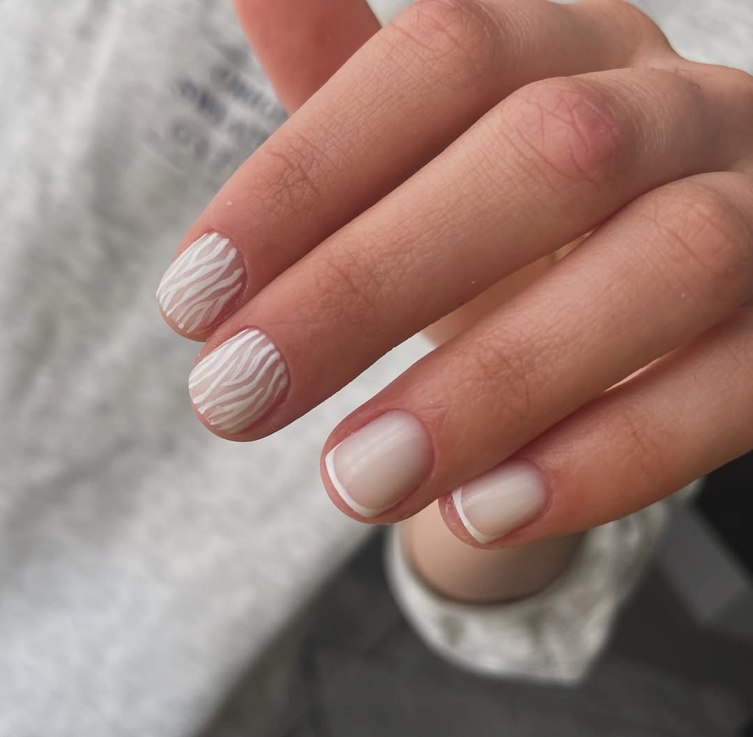 Soft White French Tips and Zebra Accent Nails