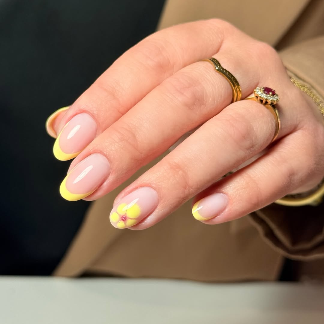 Soft Yellow French Tips with Floral Accent
