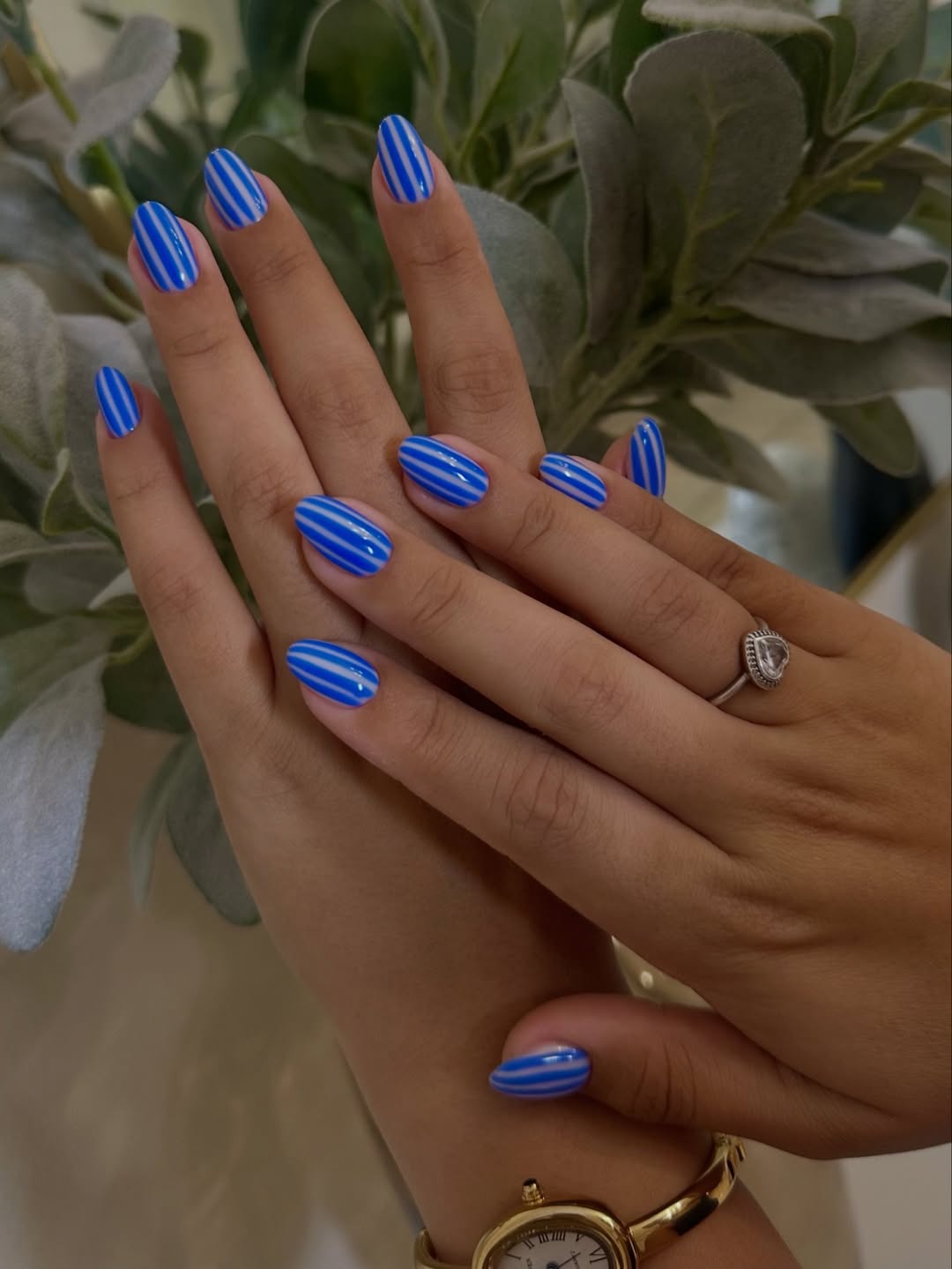 Vibrant Blue and White Striped Oval Gel Nails