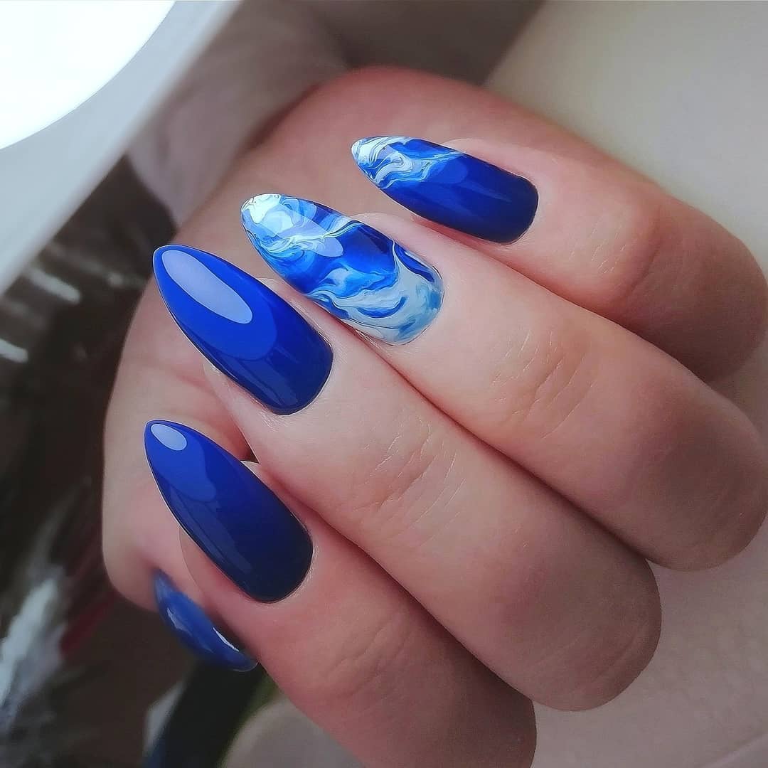 Vibrant Blue Sea Swirl Almond Nails