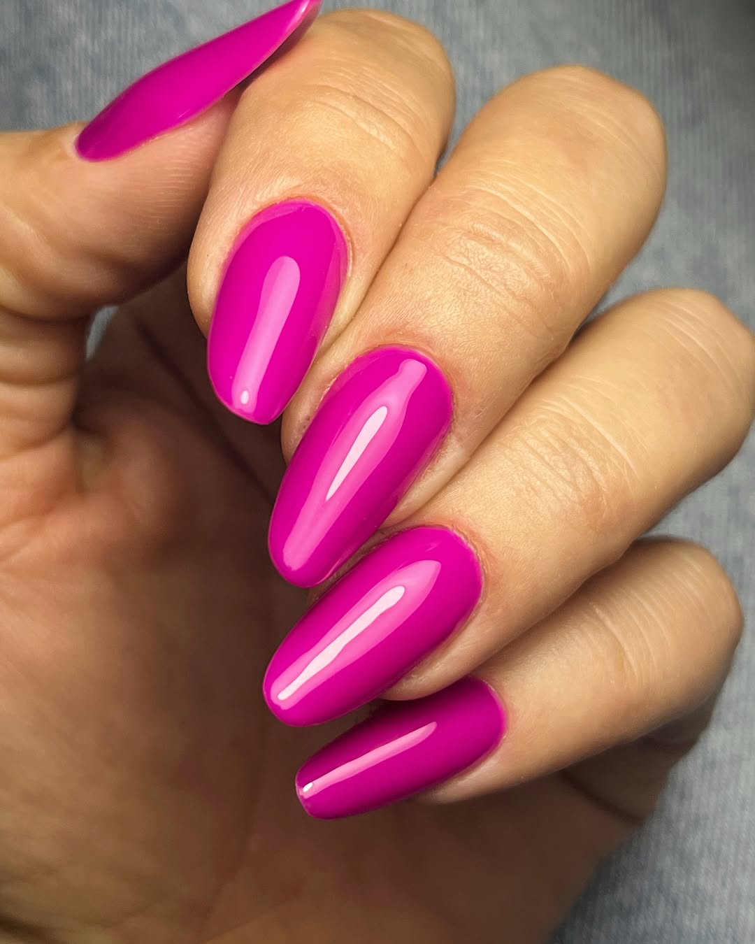 Vibrant Fuchsia Glossy Almond Nails