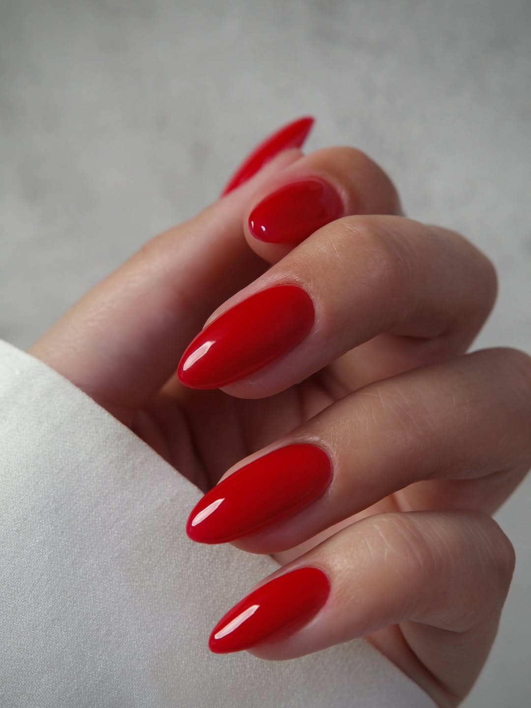 Vibrant Glossy Chili Red Oval Nails