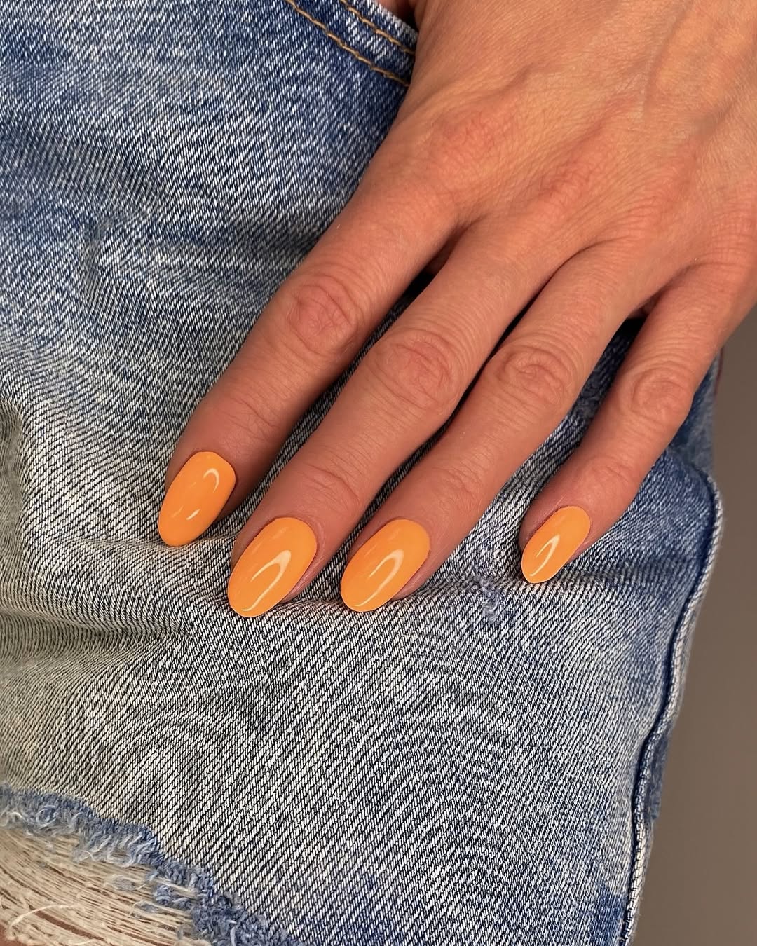 Vibrant Glossy Orange Oval Nails