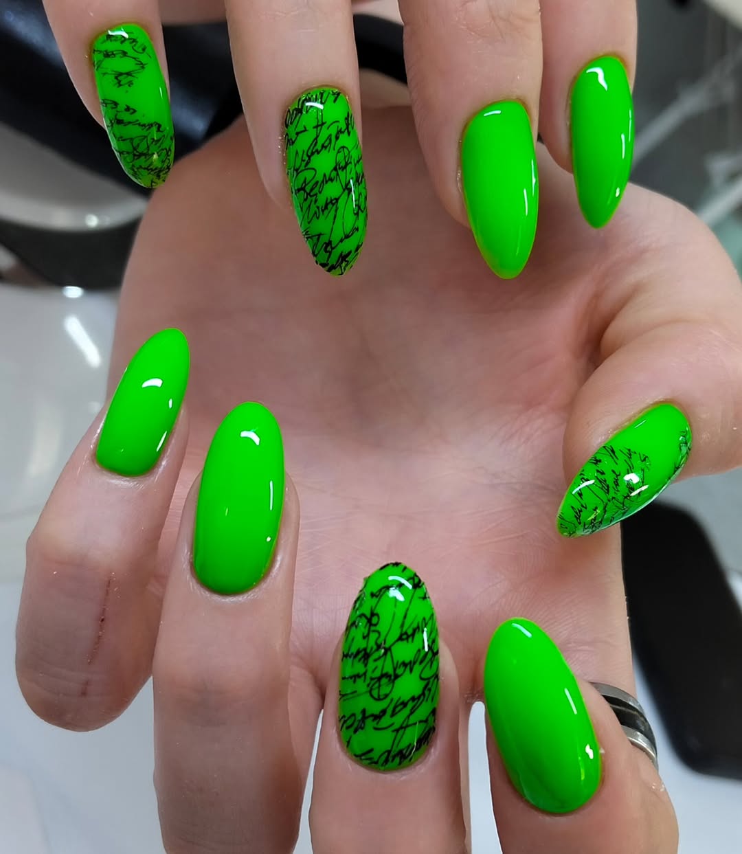 Vibrant Neon Green Glossy Calligraphy Almond Nails