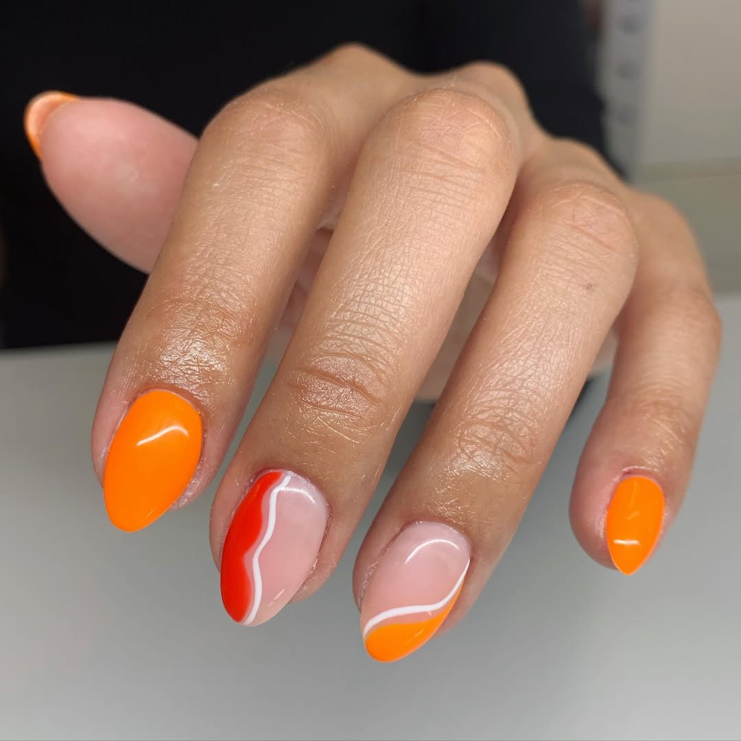 Vibrant Orange and Swirl Summer Almond Nails
