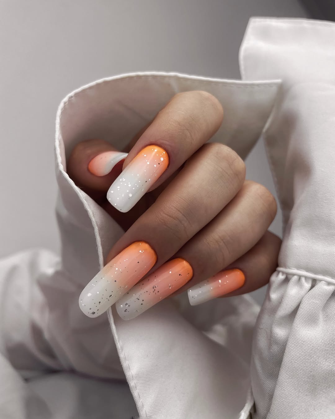 Vibrant Orange and White Glitter Ombre Coffin Nails