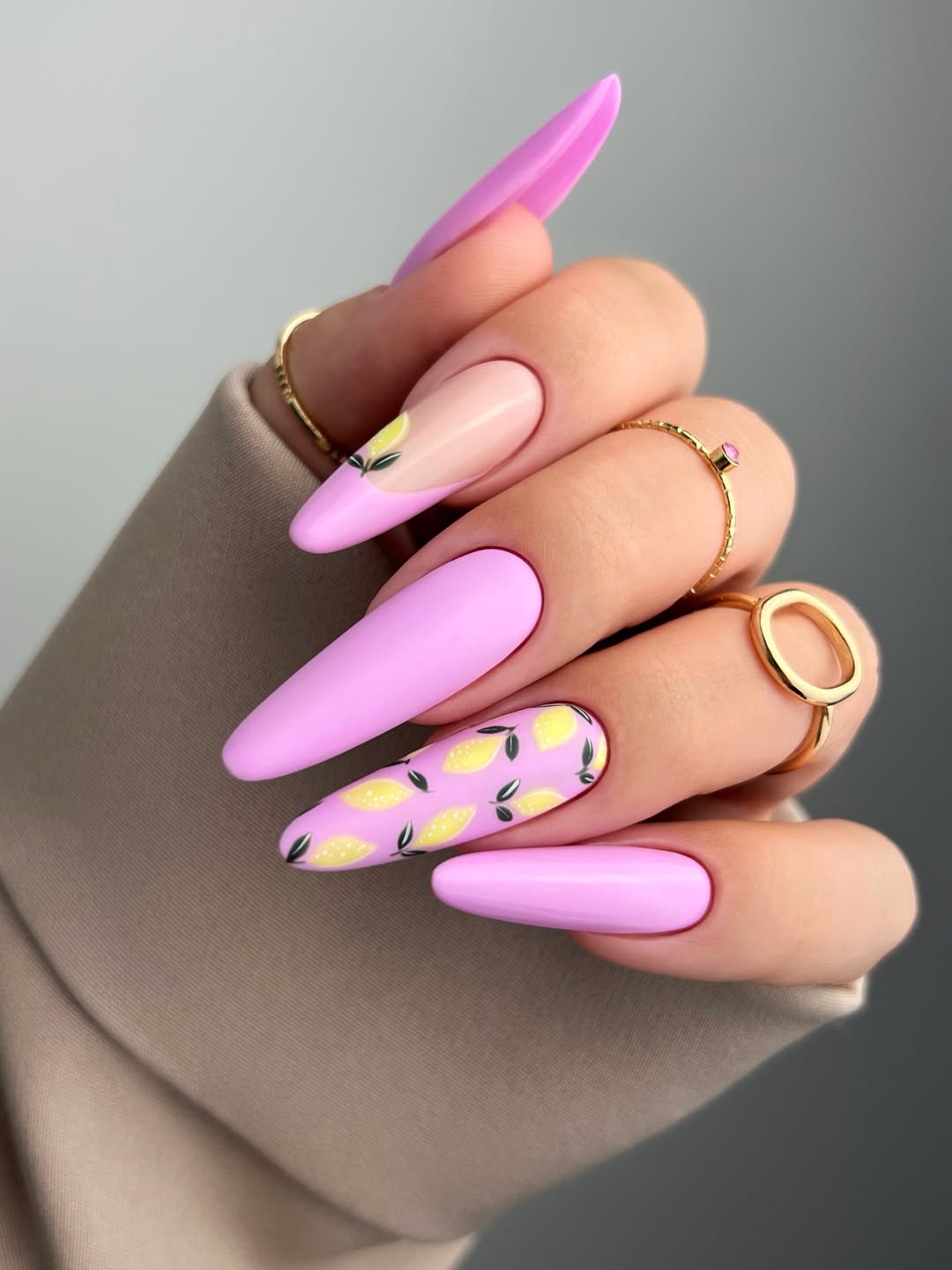 Vibrant Pink Stiletto Nails with Lemon Art