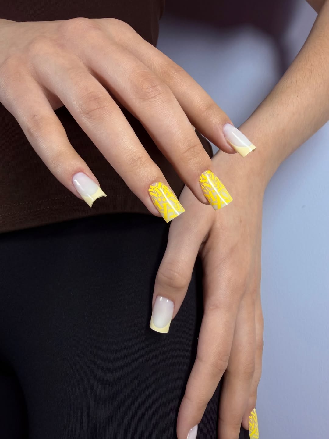 Vibrant Yellow French Tip Abstract Graphic Nails