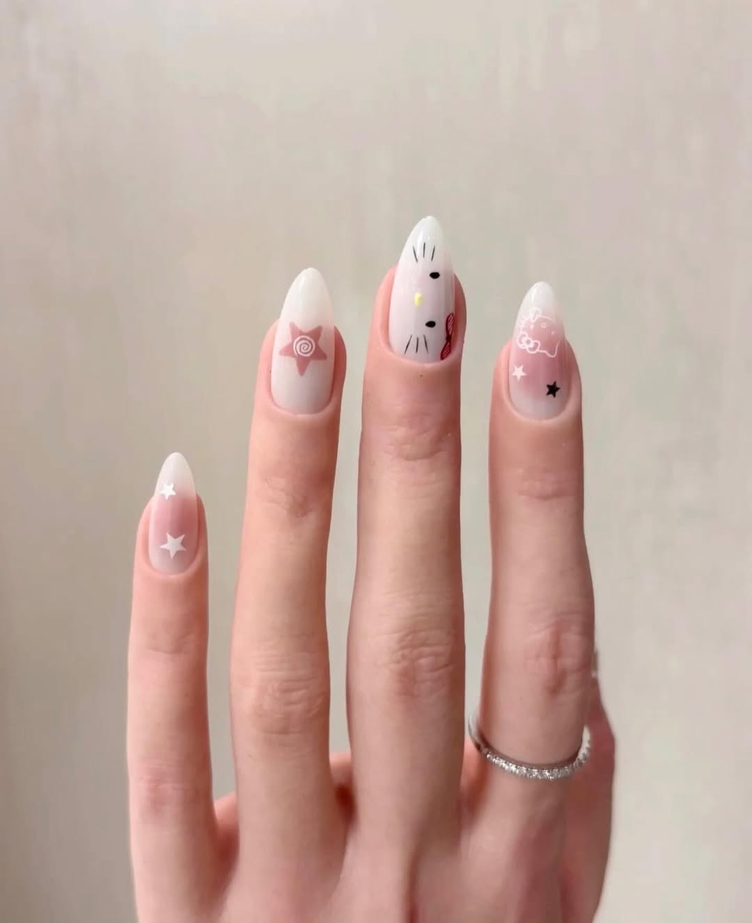Whimsical Almond Milky Pink Star And Hello Kitty Nails