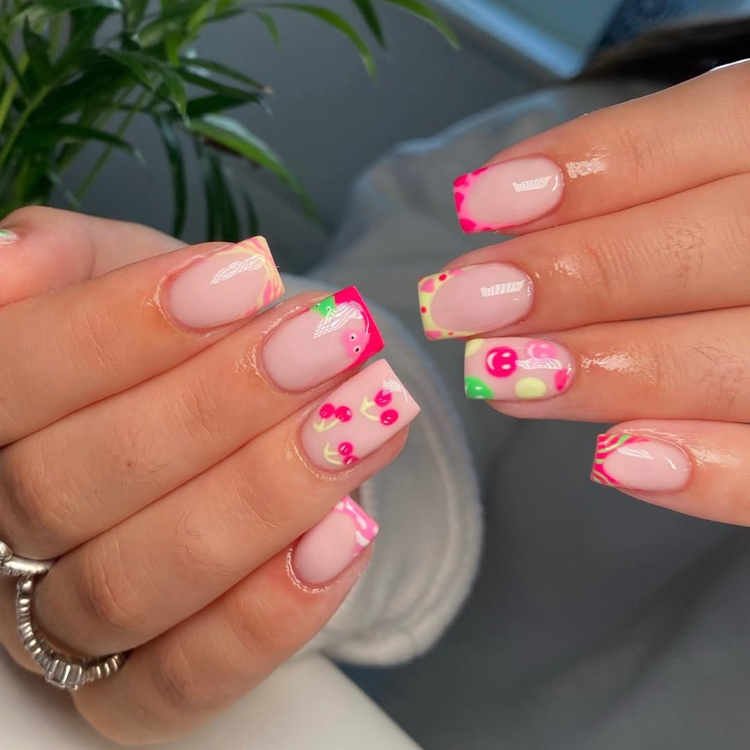 Whimsical Pink French Tips with Fruity Nail Art