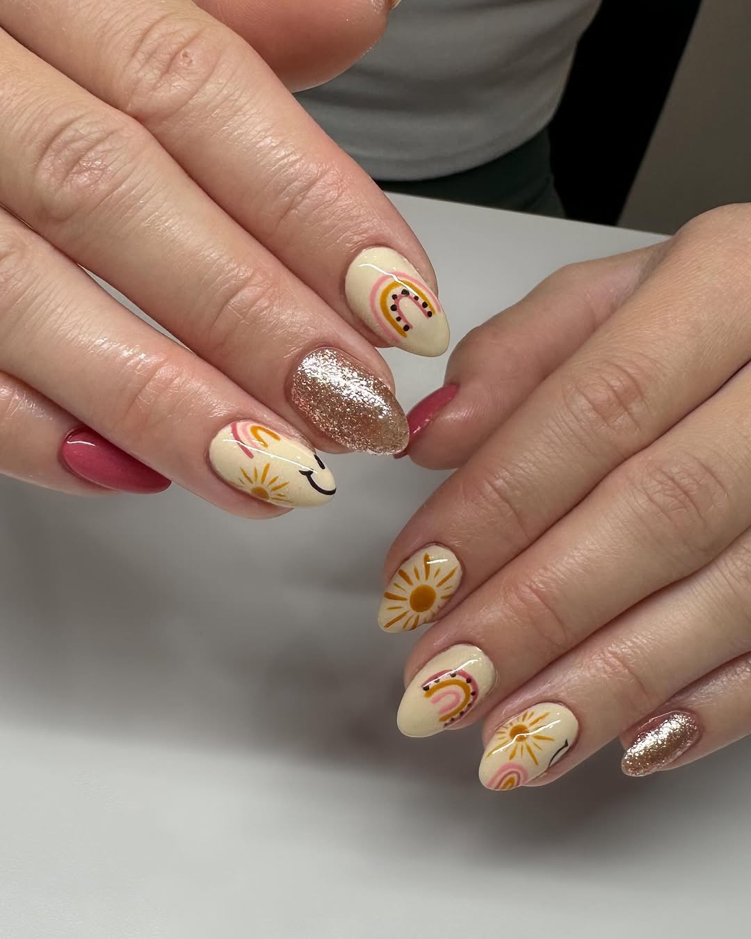 Whimsical Summer Sun and Rainbow Almond Nails