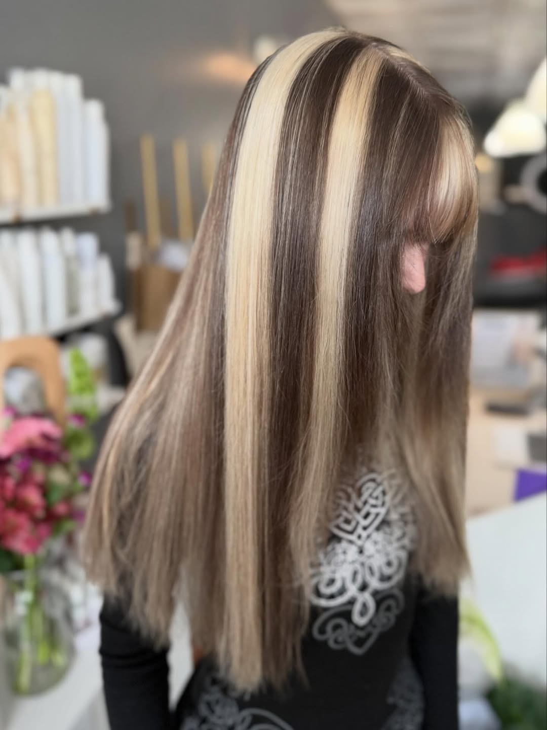 Bold Skunk Stripe Platinum Highlights on Brunette Hair