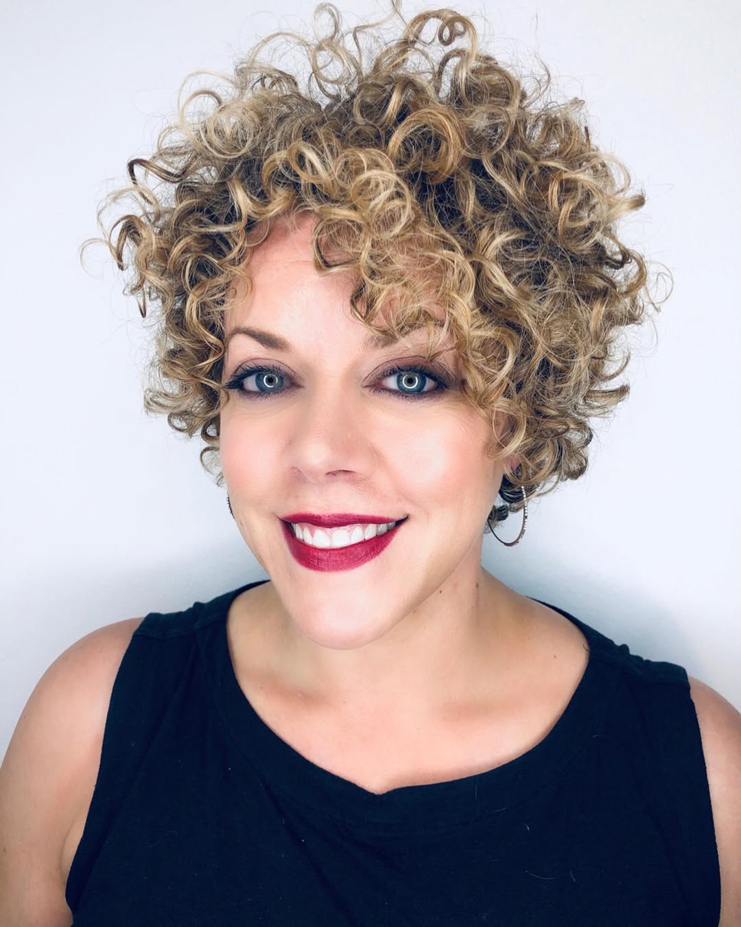 Bouncy Blonde Pixie With Voluminous Curls