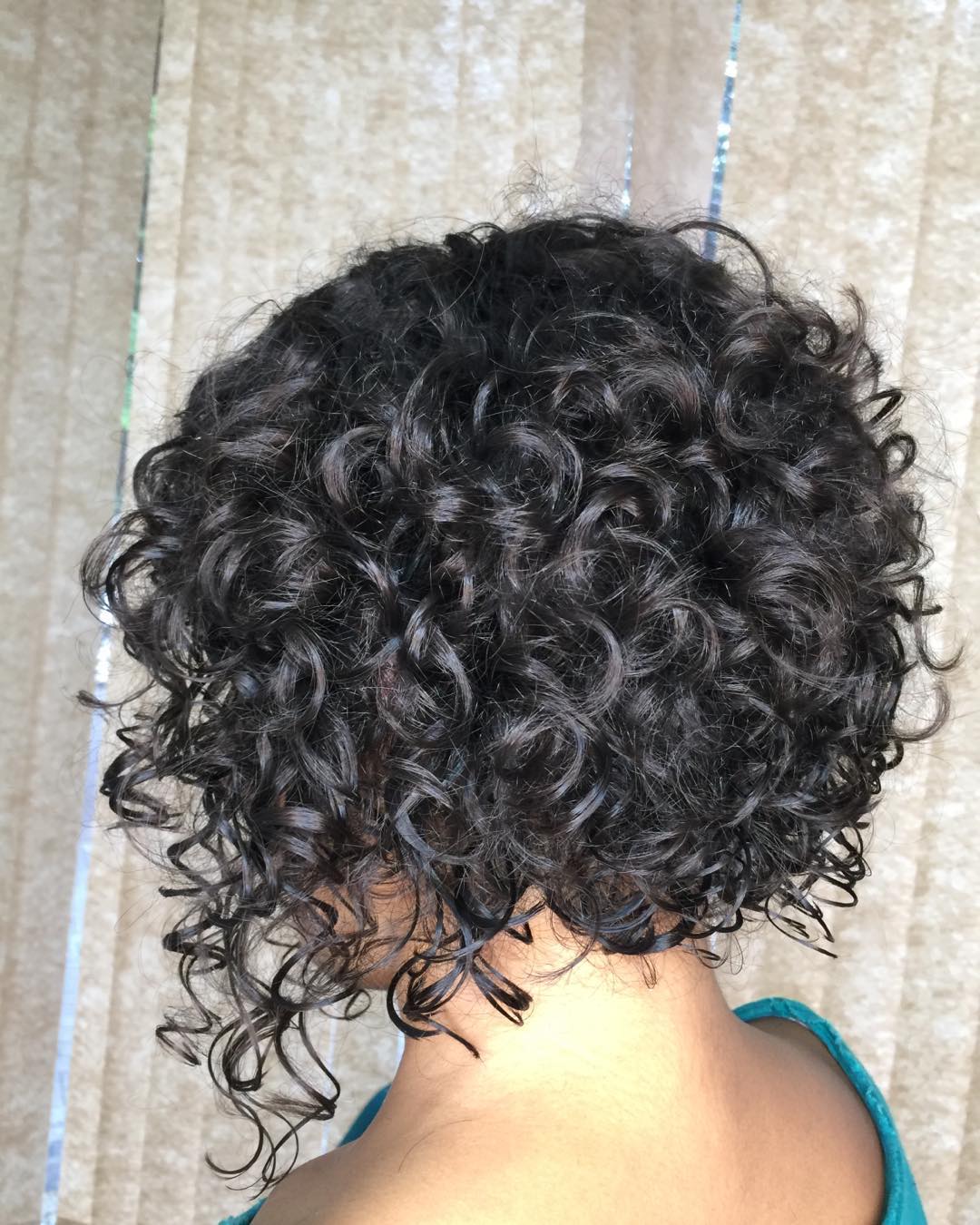 Bouncy Curly Bob On Dark Brown Hair