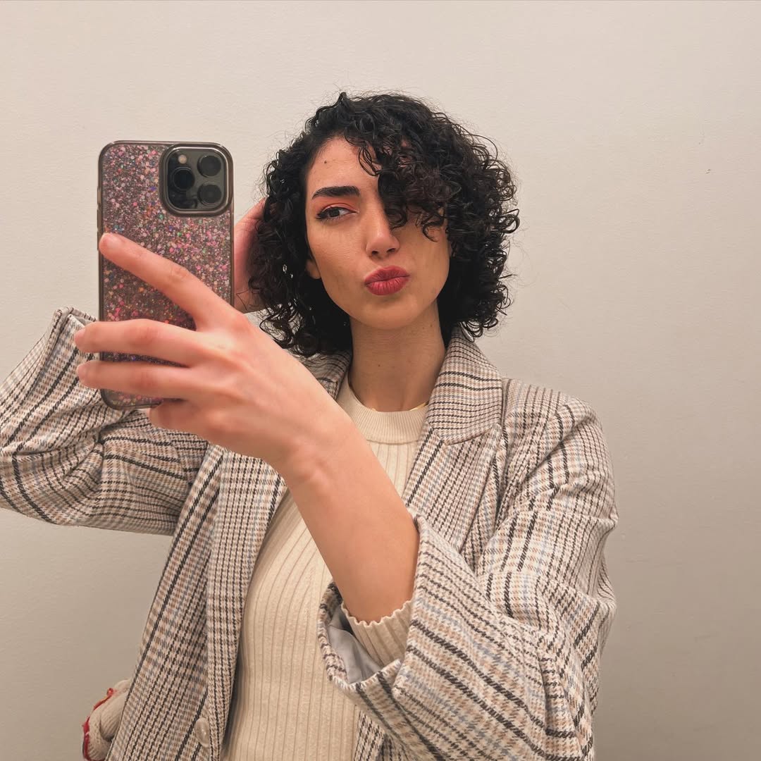Bouncy Curly Bob with Side Swept Bangs