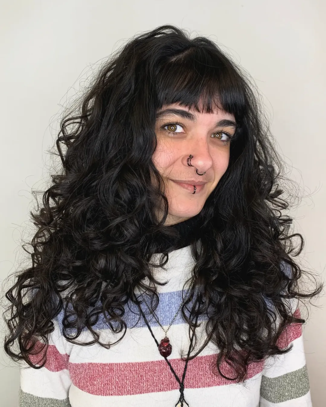Choppy Black Curly Shag With Full Bangs