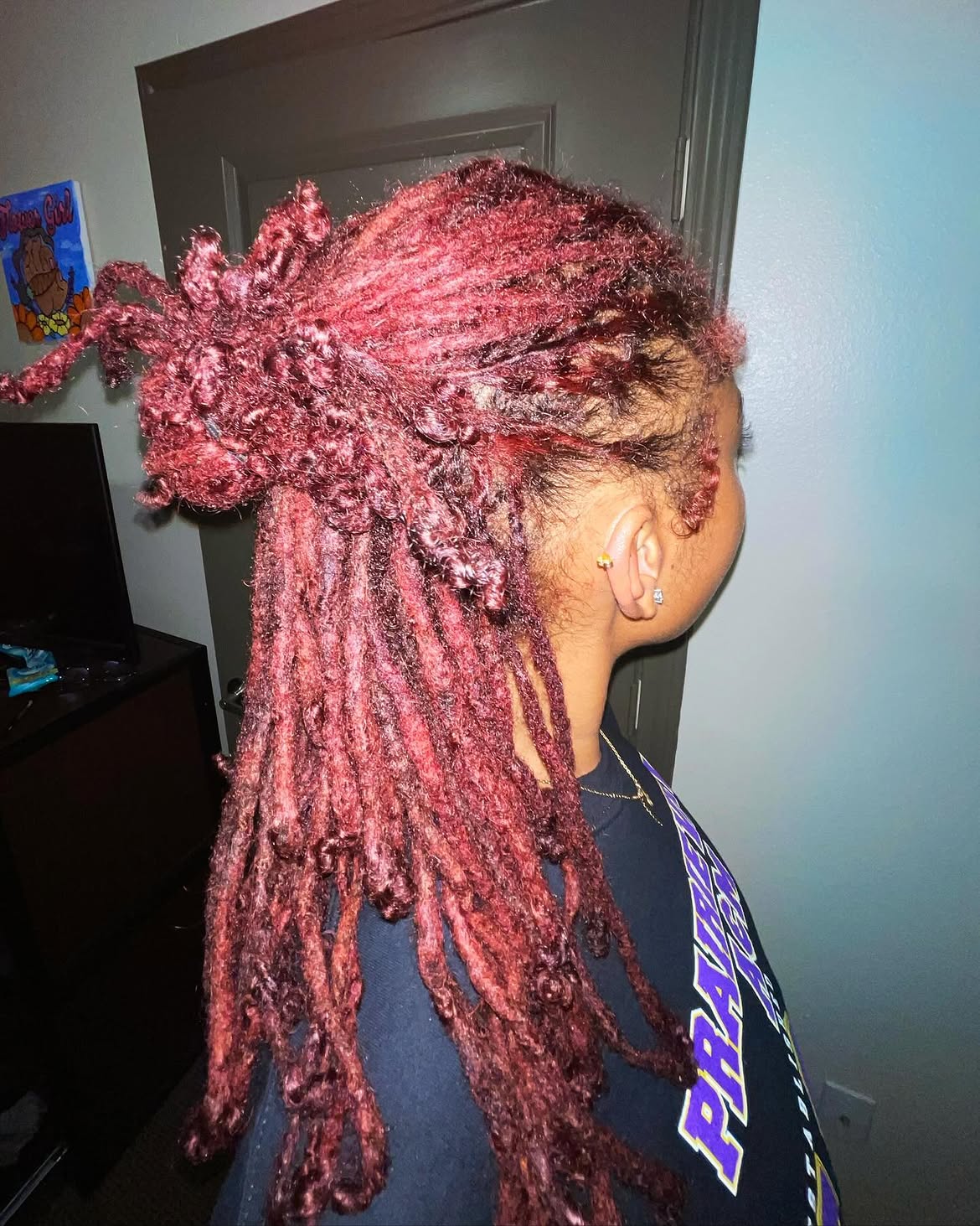 Crimson Dreads With A Top Knot Twist