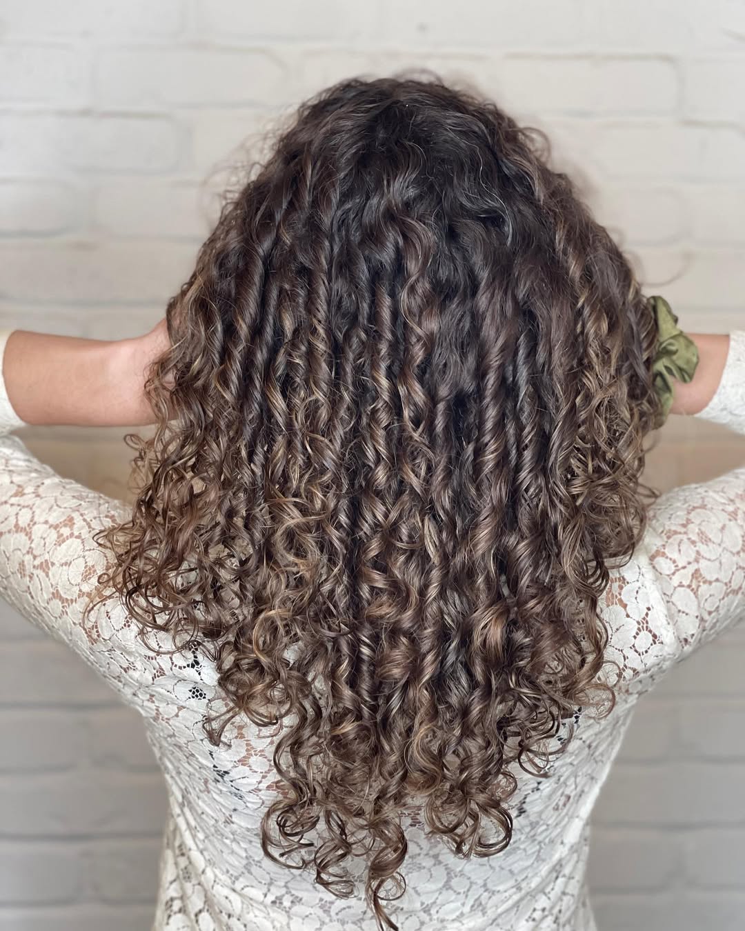 Defined Medium Length Curly Layered Haircut