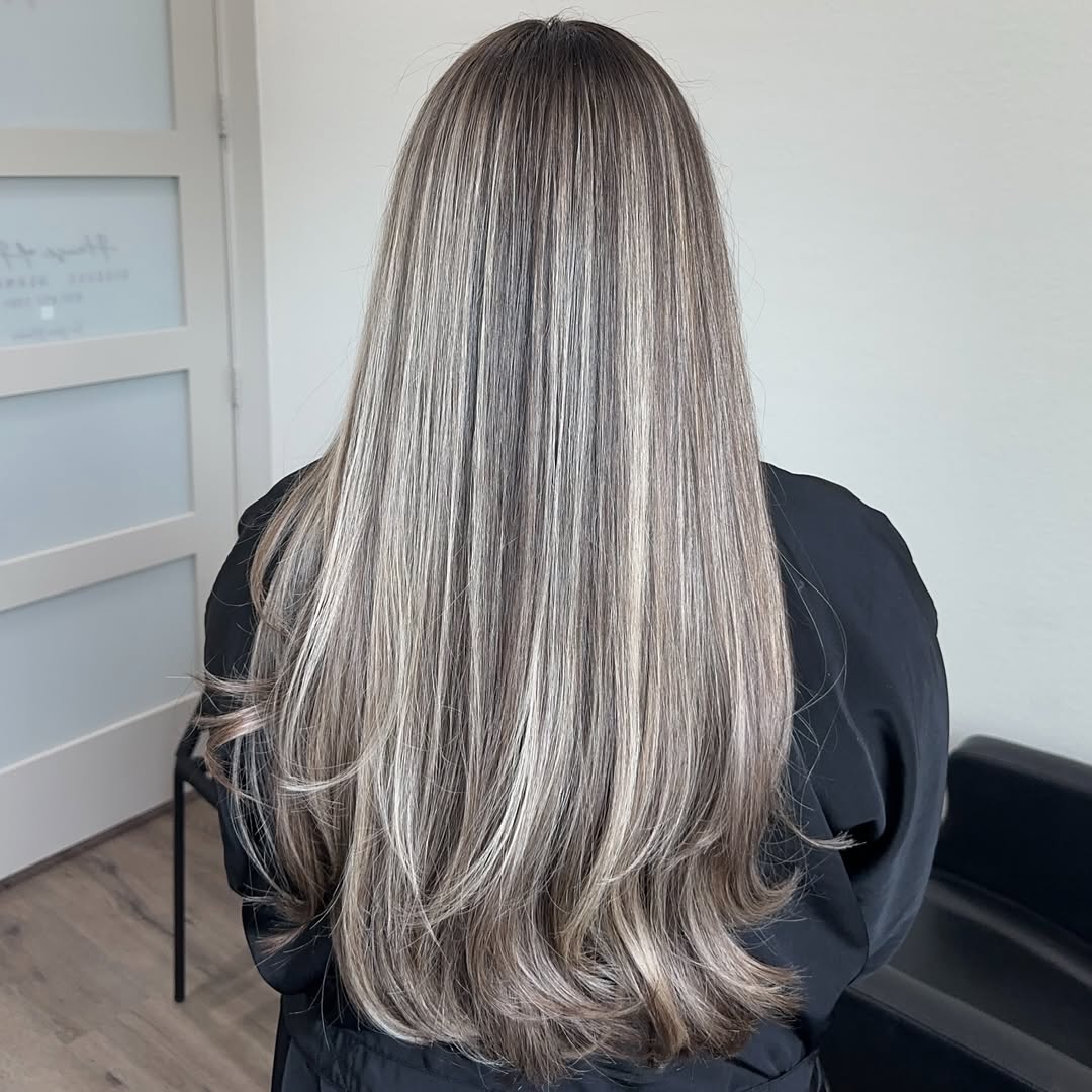 Dimensional Ash Blonde Highlights On Long Layered Hair