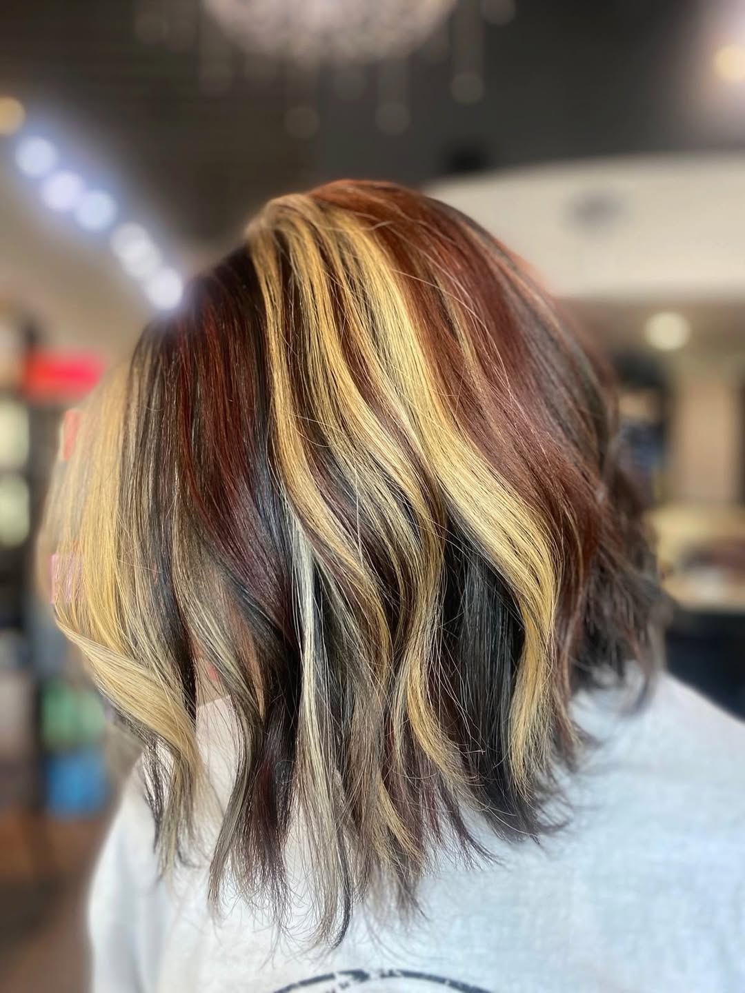 Dimensional Wavy Lob With Golden Caramel Highlights